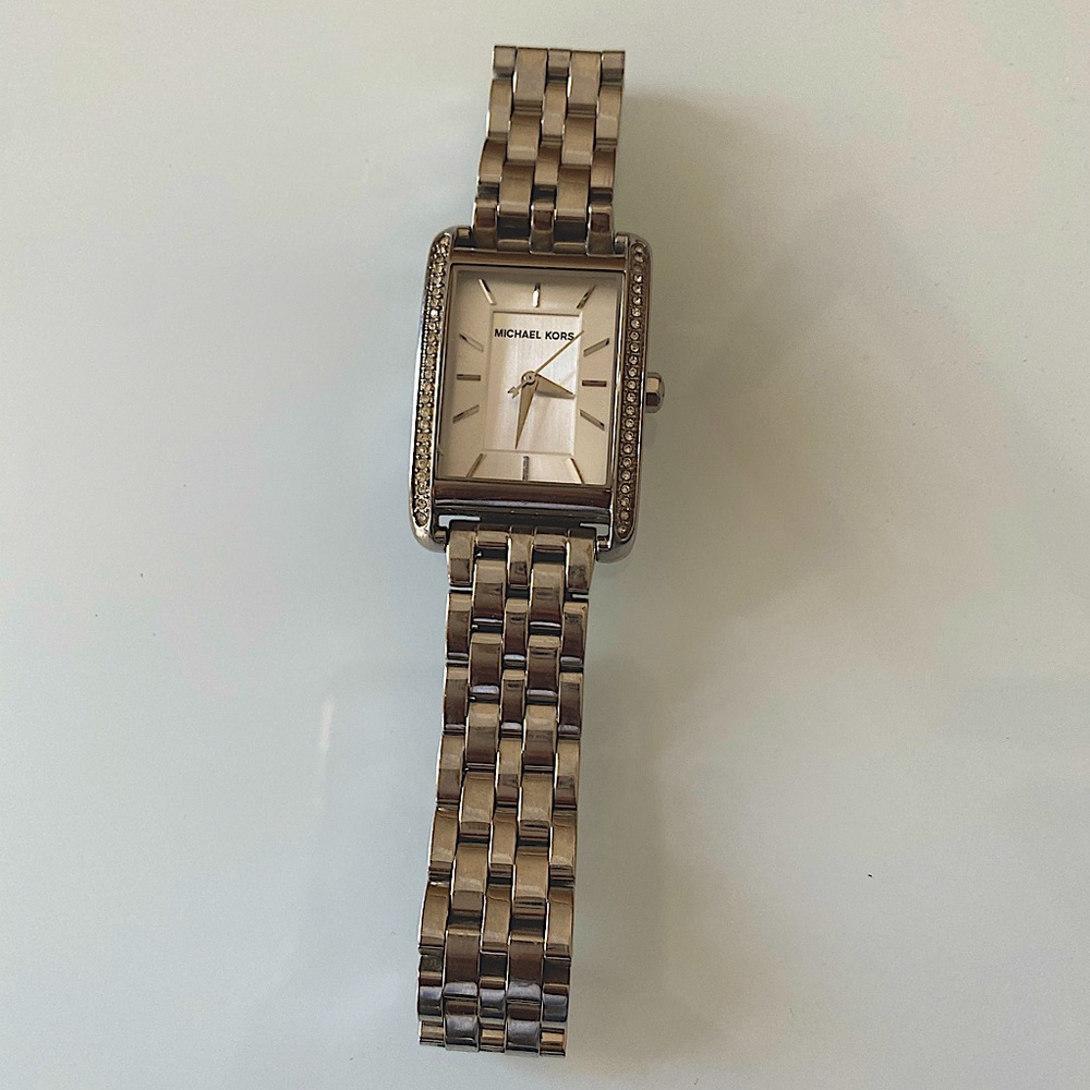 Michael Kors silver w surrounding crystals in excellent condition